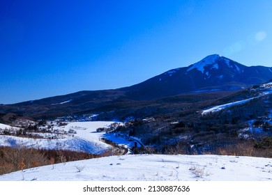 Beautiful Blue Sky And Snow Montain At Kurumayama Plateau In Winter