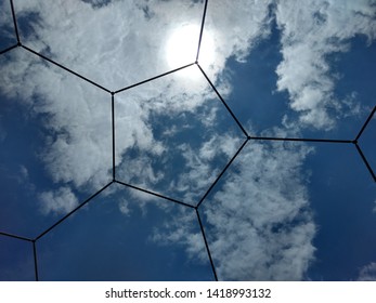 Beautiful Blue Sky View Through Pentagonal Shaped Bucky Ball. A Fresh Summer Morning View.