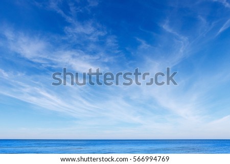 beautiful blue sky with white Cirrus clouds and calm blue sea