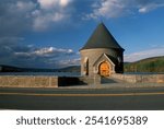 A beautiful blue sky with white clouds hangs over the Saville Dam and Spillway in Barkhamsted CT