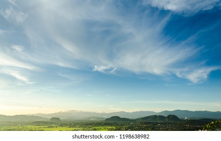 The beautiful blue sky and white clouds over rice fields and mountains, the landscape in Chiang Rai, Thailand. - Shutterstock ID 1198638982
