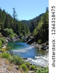 The beautiful blue Smith River near Gasquet, California (Northern California, Southern Oregon); Summer, sunny, rafting, swimming, hiking spot along Highway 199