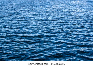 Beautiful Blue Water Of A Lake ,excited Lake Water, With Little Waves,Blue Reflections