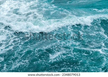 Beautiful blue wave water for abstract background from natural sea ocean in summer, motion texture pattern from outdoor seascape beach travel, aerial view bright splash surface beauty lanscape