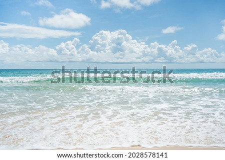 Beautiful Blue wave and white foamy nature on sunny summer day.Fantastic colorful sunset on surfing  beach.Amazing dramatic blue sky and clouds daylight.Close up no people.