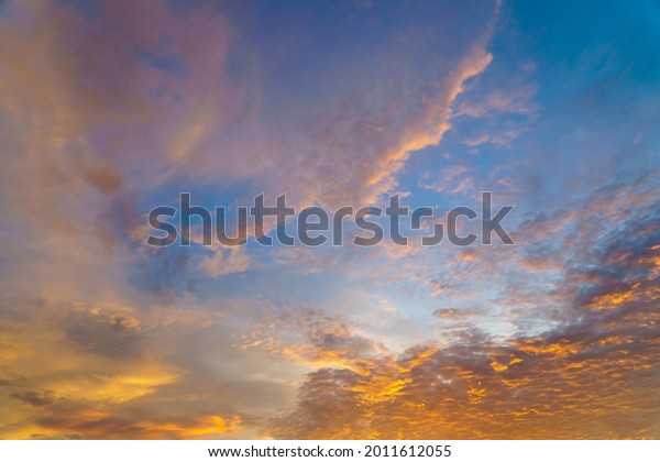 Beautiful of blurry colorful sunrise sky with cloud in a holiday for background or wallpaper. Twilight scene. Pastel sky in the morning.