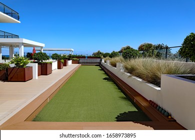 A Beautiful Bocce Ball Court On A Rooftop Outdoor Terrace, Using Artificial Turf.