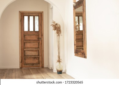 Beautiful boho interior of hallway at cozy apartment. Minimalistic Mediterranean style and design accessories. Stylish home decor. - Powered by Shutterstock