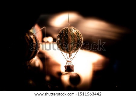 Beautiful bokeh of a small hot air balloon toy hanging.