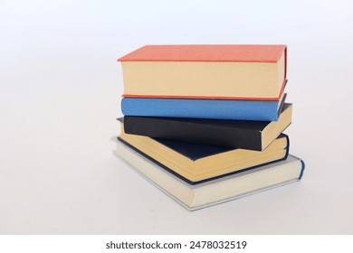 Beautiful books by famous writers on a white background, learning, knowledge, reading, schooling, studying, English language, Spanish language, Chinese language - Powered by Shutterstock