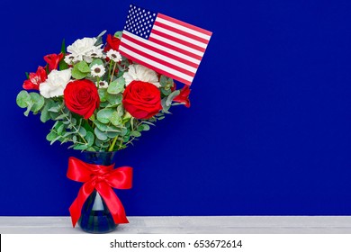 Beautiful bouquet with american flag on blue background