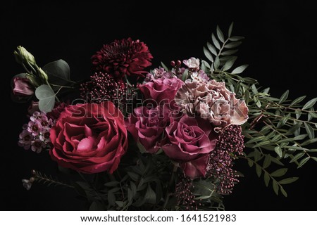 Beautiful bouquet of different flowers on black background. Floral card design with dark vintage effect