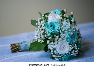 beautiful bouquet for wedding and bride with white and light blue tiffany roses