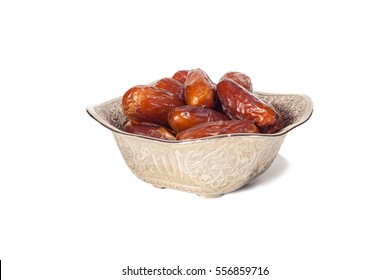 Beautiful bowl full of date fruits symbolizing Ramadan,  isolated on a white background