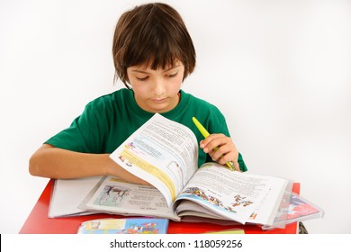 a beautiful boy doing homework