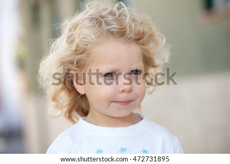 Similar – Small child with long blond hair enjoying of a sunny day