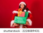 beautiful brazilian black woman, dressed as santa claus, christmas clothes. holding pile with many gifts.