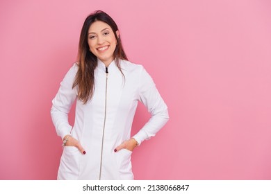Beautiful Brazilian Caucasian Woman Professional Beautician, Cosmetologist,Smiling, happy and optimistic, posing for photo with hands in pockets.