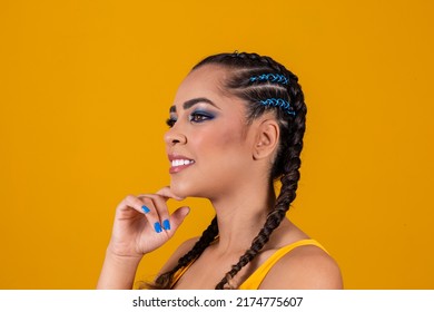 beautiful brazilian cheerleader with braided hairstyle and colorful makeup for the brazil game. World Cup and makeup. Cute girl dressed up for Brazil game - Powered by Shutterstock