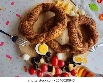 Beautiful Breakfast, bagels, tomatoes, boiled eggs, olives, cheese and tea presentation - Powered by Shutterstock