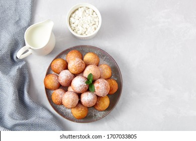 Beautiful breakfast. Cottage cheese donuts  balls  on a light background. Top view. - Powered by Shutterstock