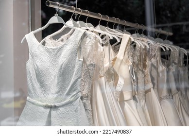 Beautiful bridal dress on hangers. Wedding dress close up at the wedding salon. Wedding dresses hanging on a hanger. Interior of bridal salon. - Shutterstock ID 2217490837