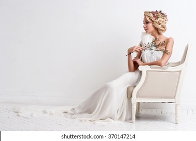 Beautiful Bride With Bouquet Over White Background