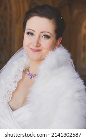 Beautiful Bride In A Fur Cape With A Bouquet