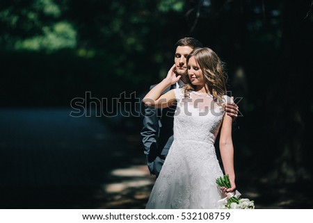 Beautiful bride and groom in the forest