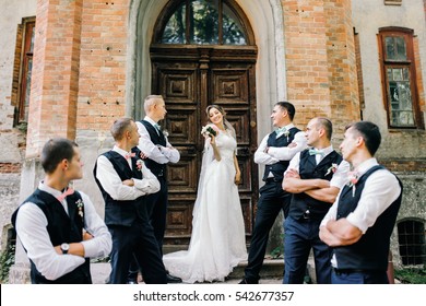 Beautiful bride with groomsmen