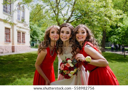 beautiful bride and her bridesmaids having fun together