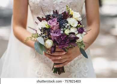 beautiful bride holding wedding bouquet  - Shutterstock ID 757821403