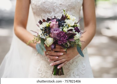 beautiful bride holding wedding bouquet  - Shutterstock ID 757821406