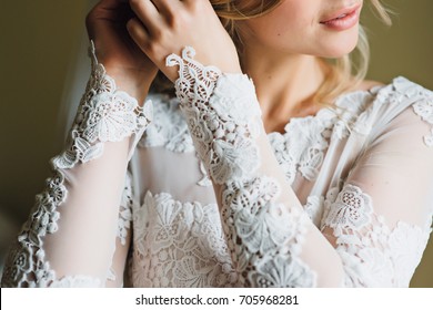 Beautiful Bride In A Lace Dress Sits 