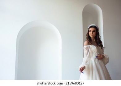 Beautiful Bride In A Luxurious Wedding Dress On White Background