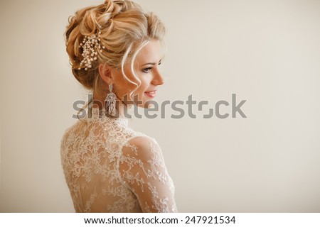Beautiful Bride Portrait wedding makeup hairstyle, gorgeous young woman in white dress at home. series. 