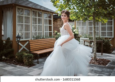 Beautiful Bride Running Away In The Garden