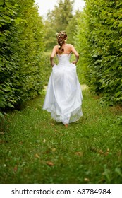 Beautiful Bride Running In The Garden