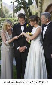 Beautiful Bride Showing His Wedding Ring To Mother In Law With Family Standing Together