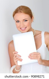 Beautiful bride using digital tablet