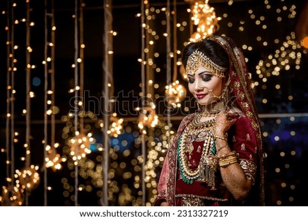 Beautiful Bride with Wedding Costume

Portrait of a Beautiful Indian Pakistani, Bangladeshi Bride with wedding dress and Ornament