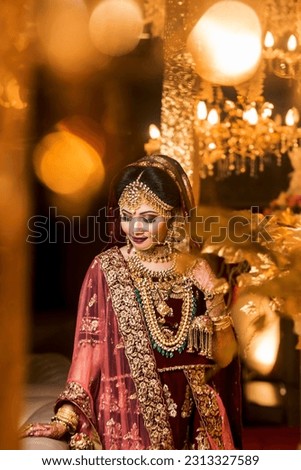 Beautiful Bride with Wedding Costume

Portrait of a Beautiful Indian Pakistani, Bangladeshi Bride with wedding dress and Ornaments