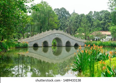 A beautiful bridge in the park near Du Fu thatched museum, Chengdu, China. 橋玉客 translated to Bridge/ Jade/ Guest. The meaning is close to 'Precious Guest Bridge' in English. 
