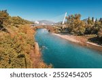 beautiful bridge at sunset, standing as a key tourist attraction in Podgorica, Montenegro connecting the urban center with the serene riverside landscape.