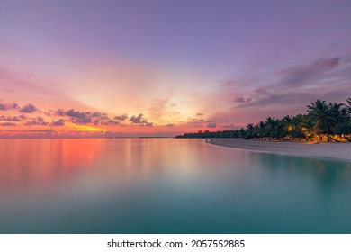 Beautiful bright sunset on a tropical paradise beach. Tranquil summer vacation or holiday landscape. Tropical sunset beach view with palm over calm sea water, Exotic nature view, inspirational scenic - Powered by Shutterstock