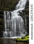 Beautiful British countryside waterfall in full flow; Scaleber Force, Yorkshire Dales National Park, UK.