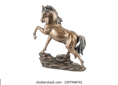 beautiful bronze statuette of a horse with a raised hoof, isolated on white background