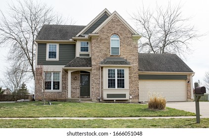 Beautiful Brown Peppered Brick Home In Late Winter