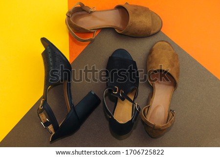 beautiful brown woman summer sundal  and heel shoe isolated on color background