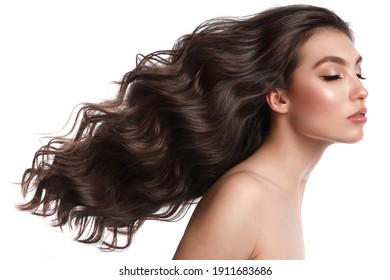 Beautiful brown-haired girl with a perfectly curls hair, and classic make-up. Beauty face and hair. Picture taken in the studio. - Shutterstock ID 1911683686
